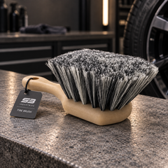 SB Industries Tire Brush concept with light tan handle and grey bristles
